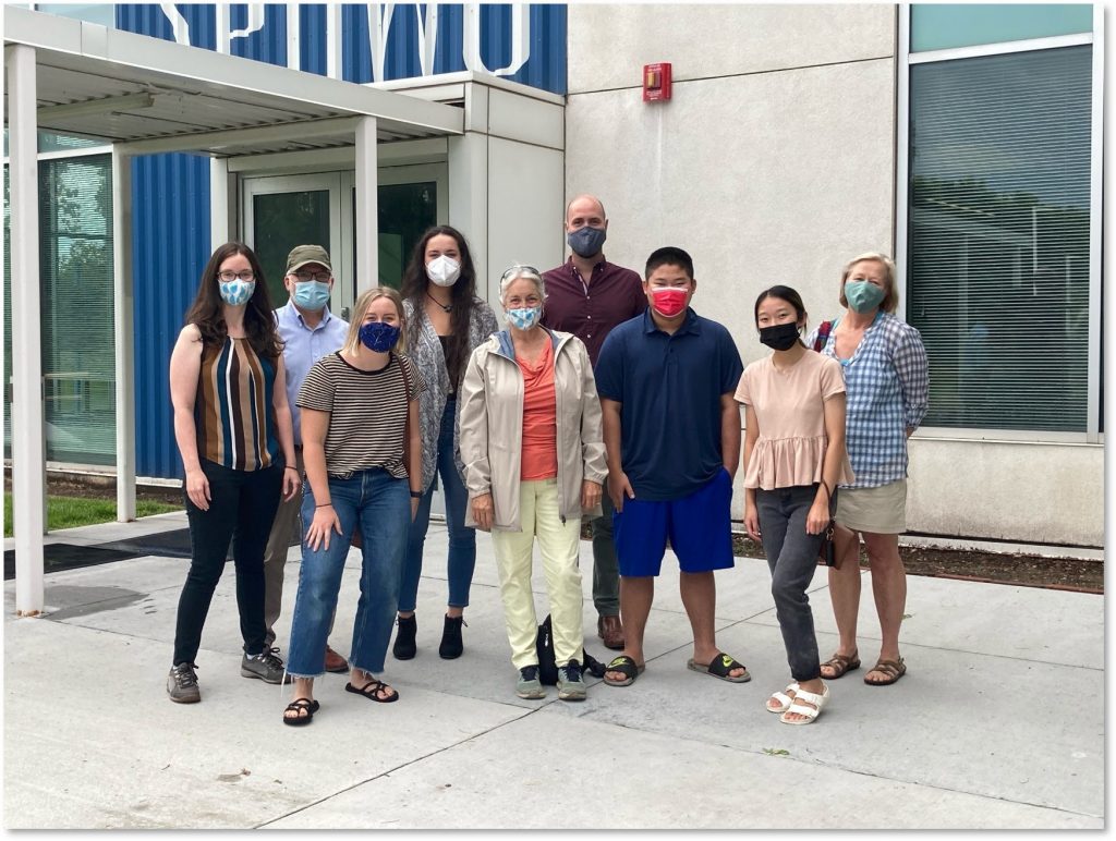 Photograph of a group of 9 people, including Lala, Winner, and Carrie Jennings, at the St. Paul Water Treatment Plant.