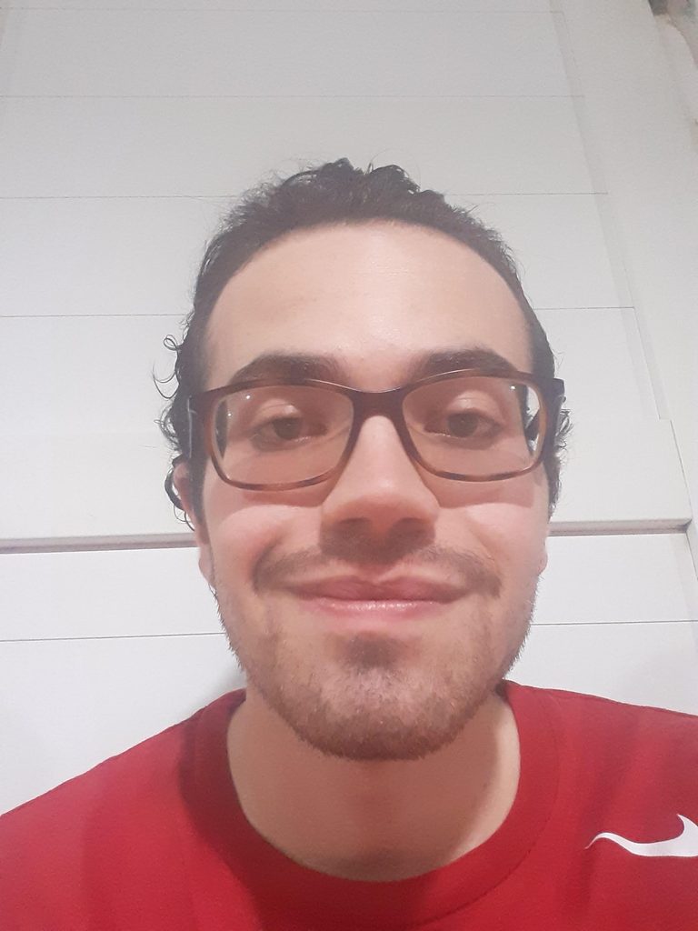 Photo of José Daniel Batres-Pearson, recipient of 2026 Hydrogeology Field Camp Award. José is wearing a red shirt in front of an interior wall background.